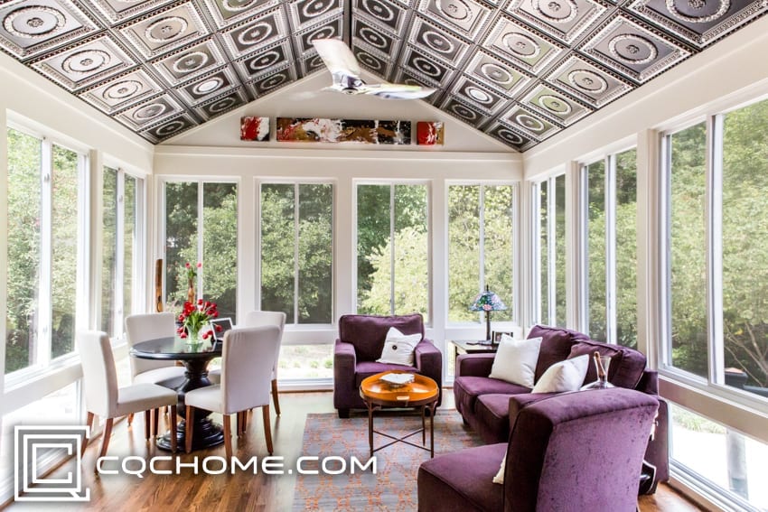 A sunroom with bold ceiling tile.