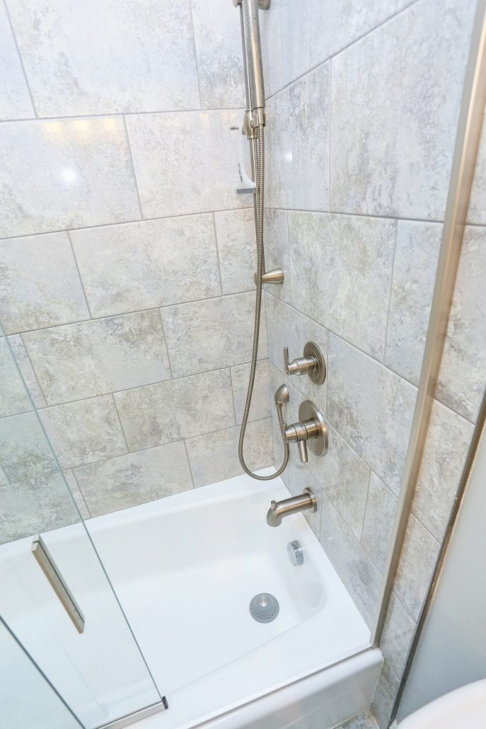 Updated shower with new tile, fixtures, and re-glazed tub